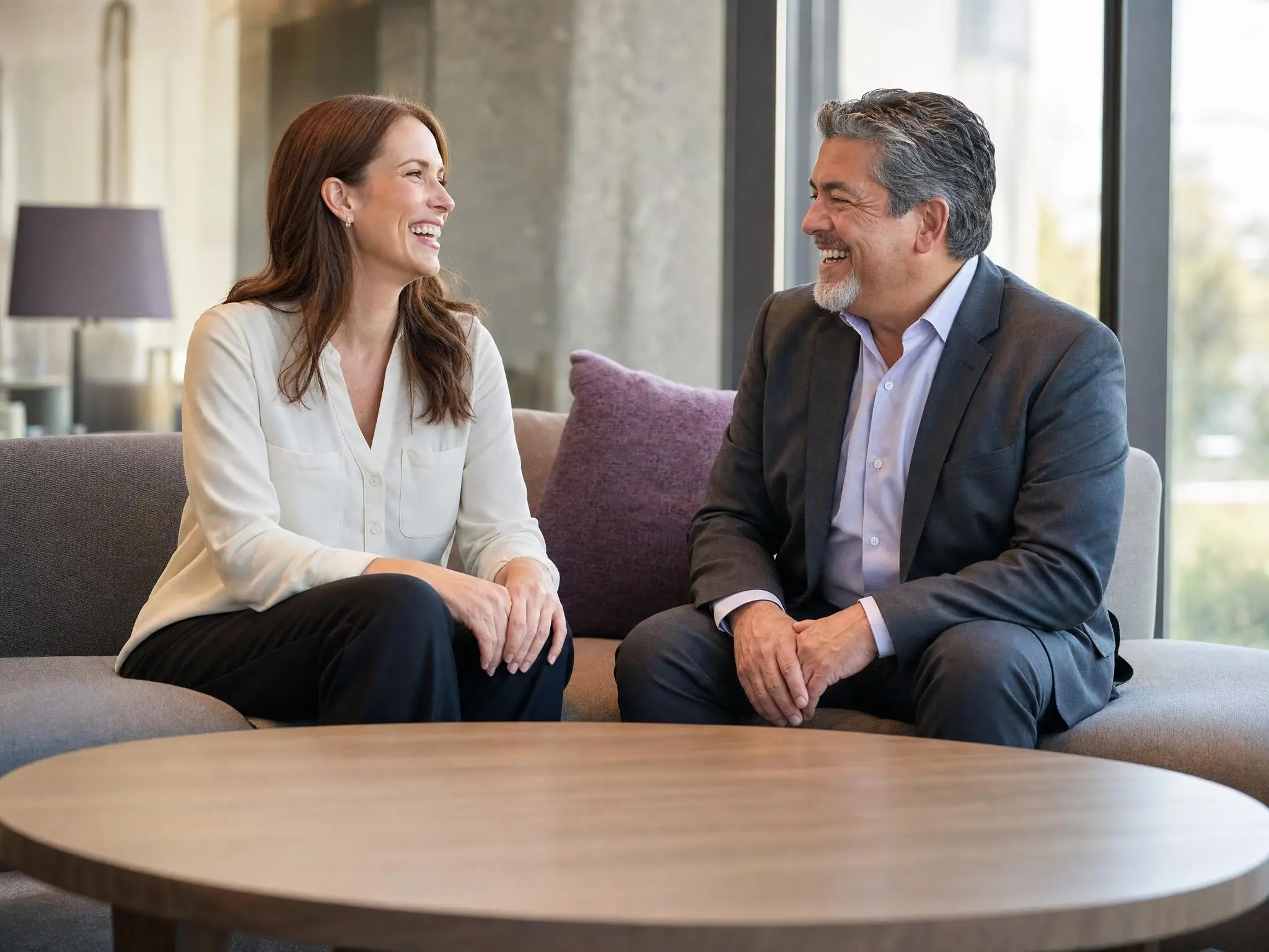 A publisher and a WRSS distribution strategist laughing partway through a planning conversation.