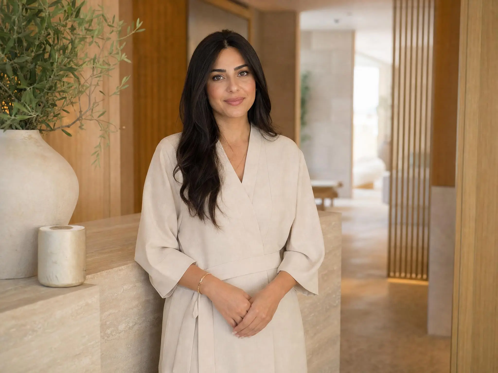 A day spa director standing in her reception area.